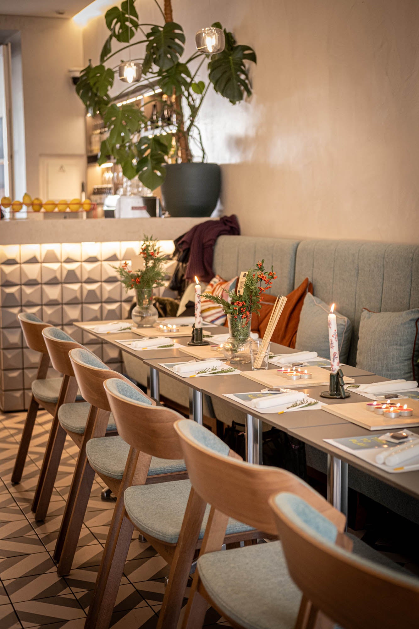 Dining area with tables set for meals, chairs, and decorative elements in a restaurant.