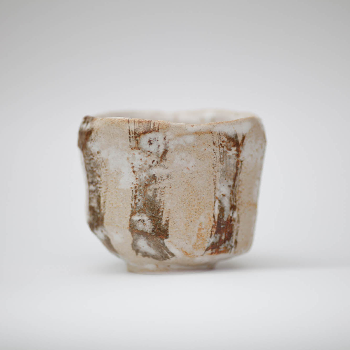 Ceramic bowl with a textured surface on a white background